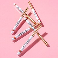 several pink tubes of lipstick